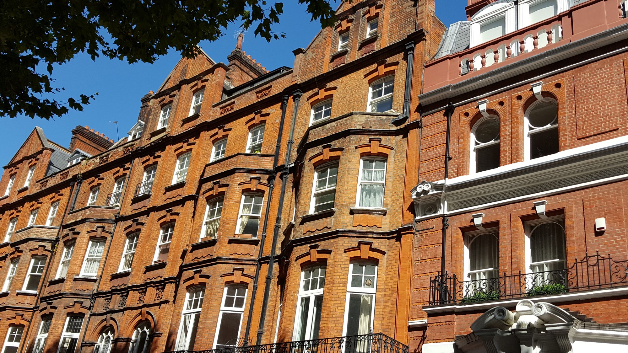 masonry building with brick facade, wooden floors and timber roof structure